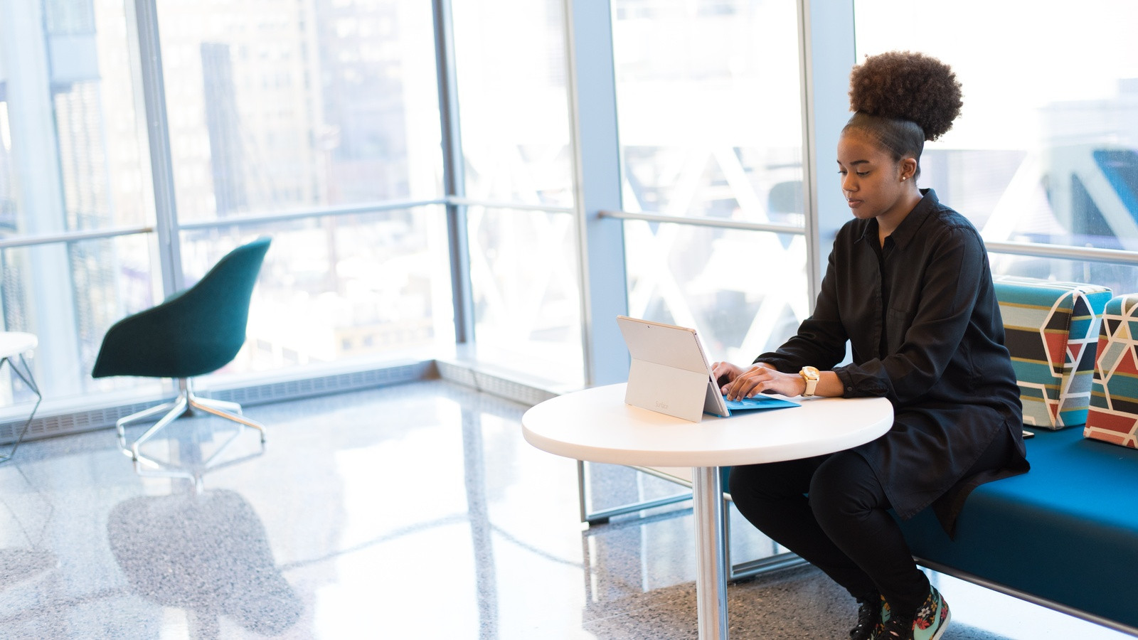 Two software engineers collaborating at a clean modern tech workstation with natural window lighting, reviewing bug reproduction steps on an ultrawide monitor